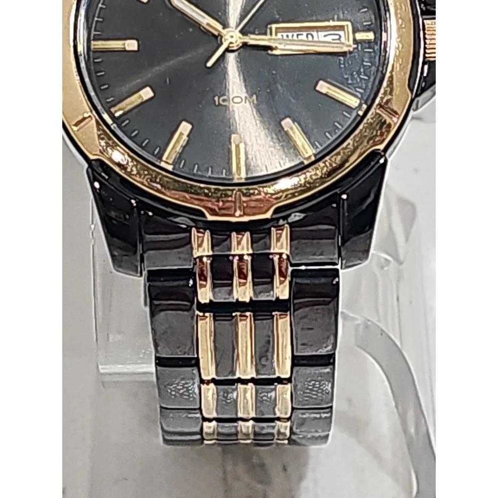Seiko Quartz 100M watch (black and gold two-tone with day/date)